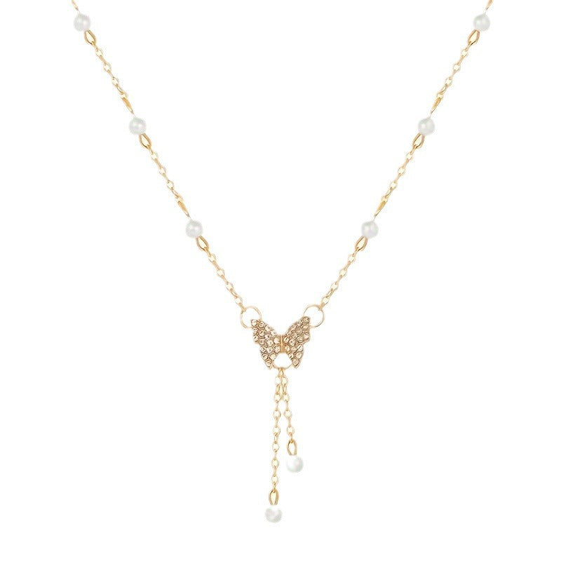 Pearl Butterfly – Halsband i Guldfärg med Pärla